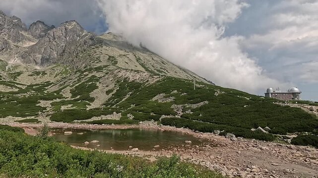 lomnicky stit peak view high tatras carpathians mountain landscape green valley cable car slovakia scenic alpine nature summer clouds concept of travel tourism outdoor adventure