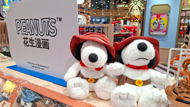 cute peanuts snoopy plush dolls wearing explorer hats and red scarves on September 16, 2026 in Bangkok, Thailand.
