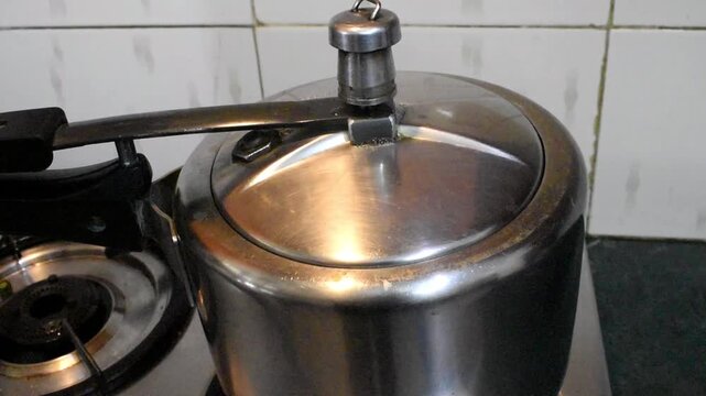 cooking at Indian Kitchen, use pressure cooker