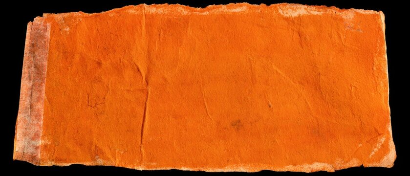 Vibrant orange textured paper with torn edges on black background