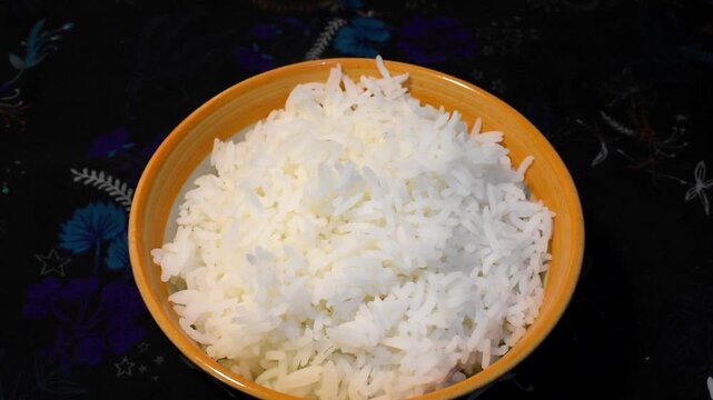 Freshly steamed white rice served in a bowl.