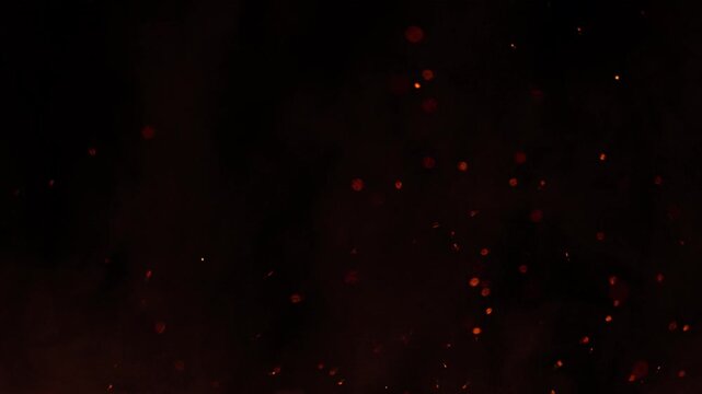Super Slow Motion Shot of Flying Fire Sparks Isolated on Black Background at 1000fps.