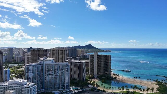 Aerial drone view of Waikiki Beach, Duke Kahanamoku Lagoon, and Diamond Head in Honolulu Hawaii