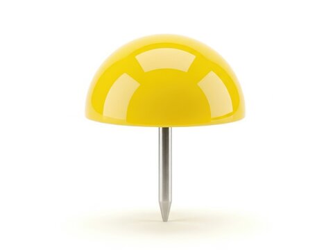 Bright yellow mushroom-shaped push pin on desk