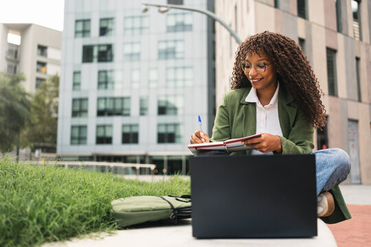 African American Business Woman Entrepreneur Working with laptop Outdoors