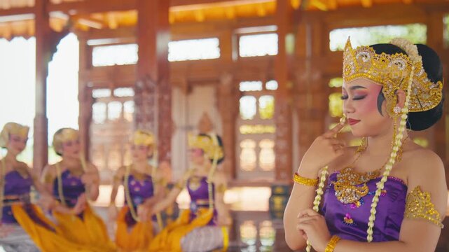 Traditional Dancer Gently Touching Jasmine Garland on Her Chest
