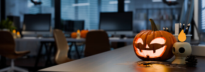 Plakat 3D Illustration of Halloween Office Decoration with Glowing Jack O Lantern Pumpkin on Desk