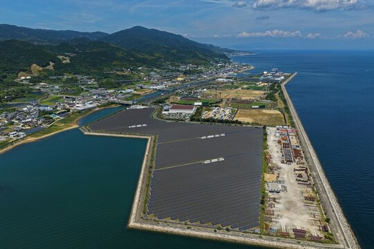 Aerial drone photo of large-scale solar panels and coastal area in Awaji City, Hyogo