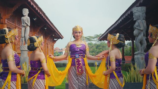 Traditional Dance Troupe Posing Together in Tropical Garden