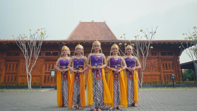 Full Body Portrait of Dance Troupe Standing in Front of Pendopo