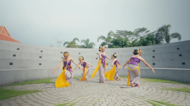 Traditional Dancers Moving in Circular Formation Outdoors