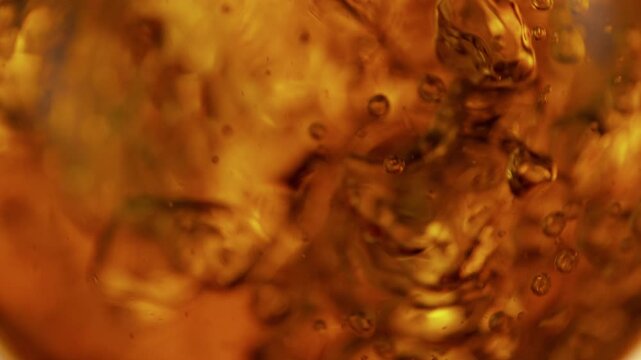 Super Slow Motion Shot of Waving Golden Liquid Background at 1000fps.