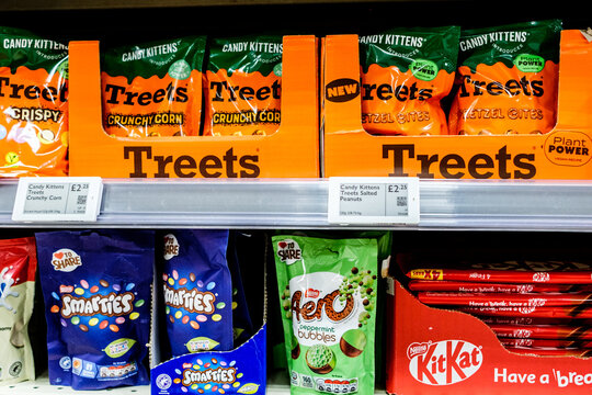 Bags Of Brand Name Confectionery And Chocolates On A Waitrose Supermarket Shelf With Price Tags