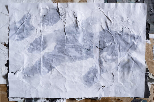 Weathered White Paper Poster Texture with Running Horse Silhouette Wet Glue Marks Plastered on a Dirty Wall