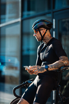 Athletic Rider Prepares For Workout. Fitness Enthusiast Readies Himself For Intense Late Afternoon Session