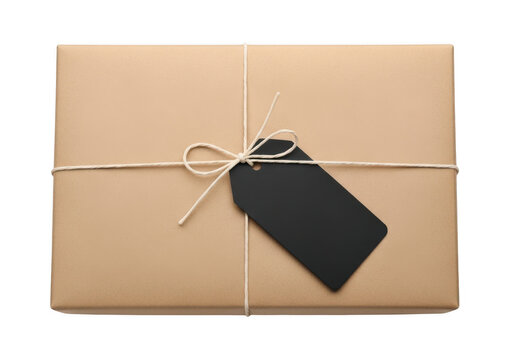 Brown paper parcel gift box with black tag and string isolated on transparent background