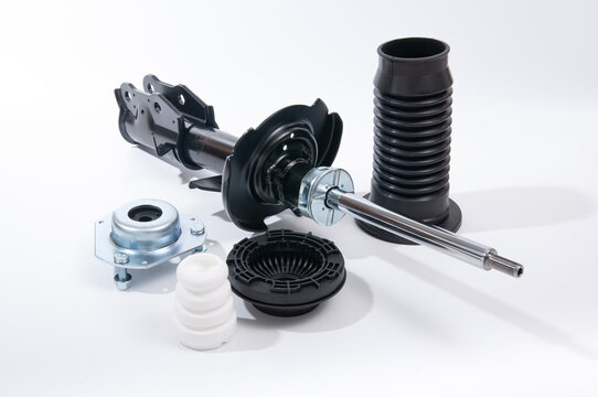 Set of new car front and rear shock absorbers with accessories.