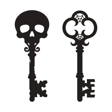 Two antique keys shaped as a skull and ornate design silhouette