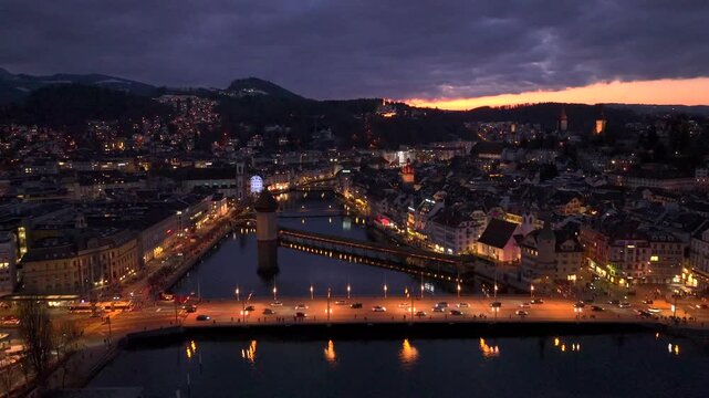 Lucerne City in Switzerland at Winter Time, Aerial Drone Shot of Old Town with Kapellbruecke and Wasserturm Luzern.