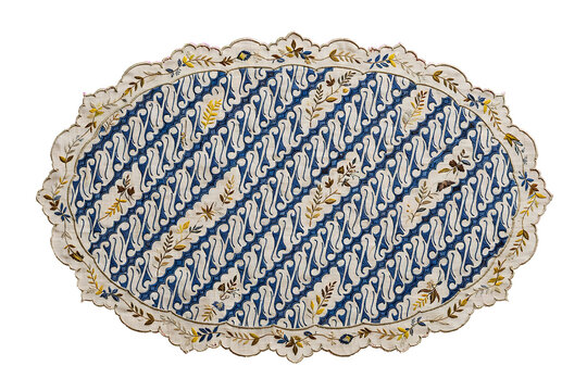 Oval batik doily with traditional parang pattern and floral embroidery