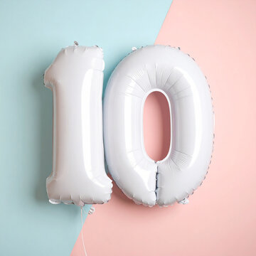 Puffy white number 10 balloon with rounded inflated shape, pale pastel background, clean festive aesthetic. Close-up.