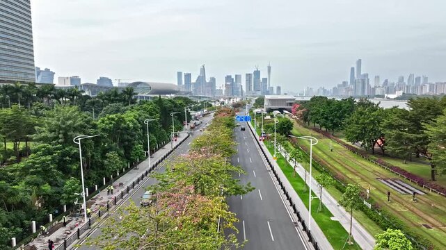 Modern City Avenue with Green Landscaping and Distant Skyline in Guangzhou, China