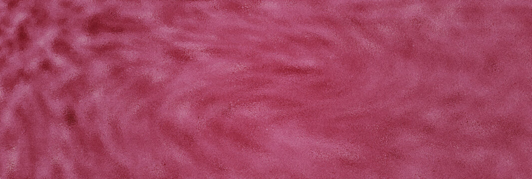 Deep magenta velvet fabric texture background with soft light and shadows