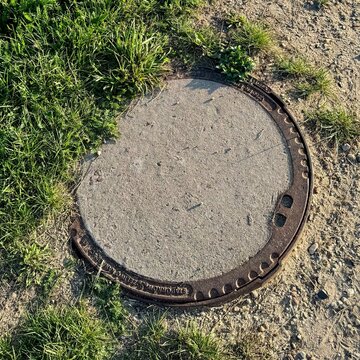 old manhole cover, city ​​hatch