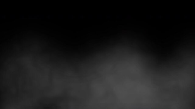 Slow moving grey fog and smoke rolling against black background