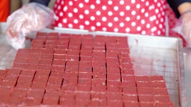 Preparing diced gethuk pisang. Gethuk pisang is a traditional Indonesian food made from bananas and is typically wrapped in banana leaves.
