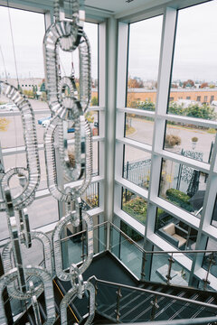 Modern staircase and crystal chandelier at Chateau Le Parc