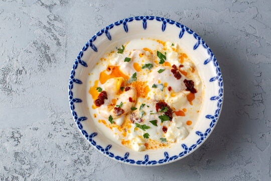 Cilbir, also called "Turkish Eggs", is a dish served as mezze: poached eggs topped over herbed greek yogurt, then drizzled with hot spiced paprika olive oil.