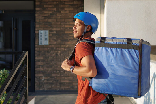 Food delivery service courier reaching delivery destination