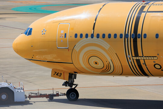 ANA Boeing 777-200ER in Star Wars C-3PO livery on landing approach on April 26 2025 at Fukuoka Airport Japan