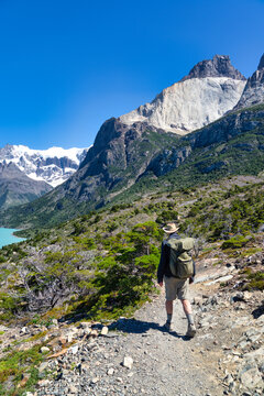 Rear view of a man hiking on the W Circuit near Nordenskjold Lake and Los Cuernos,  Torres del Paine National Park, Chile