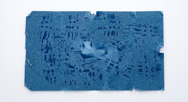 Macro close-up of used dental articulating paper showing dynamic bite patterns