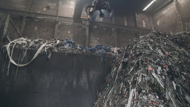 Large Pile of Municipal Waste and Plastic Debris in Recycling Plant