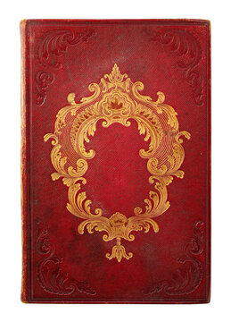Antique red morocco leather book binding with elaborate gilt rocaille ornament, floral motifs. Embossed cover with baroque and rococo decoration, luxurious appearance, isolated on a white background.