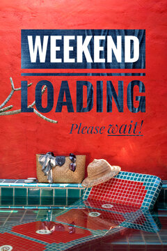 Weekend loading banner on red wall of swimming pool, vertical stye, summer outdoor day light