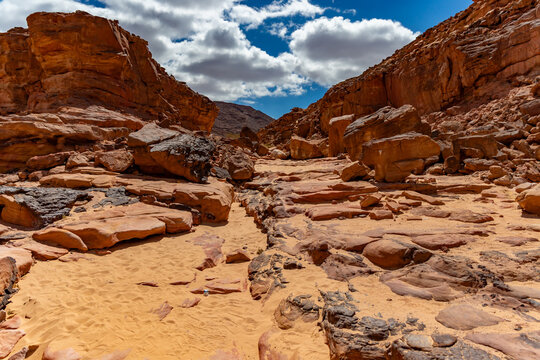 Rugged rocky canyon bed littered with sandstone boulders, Sinai Desert, Sinai Peninsula, Egypt