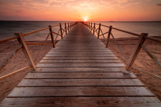 Wooden pier on a sandy beach at sunset, Sharm El Sheikh, Sinai Peninsula, Egypt