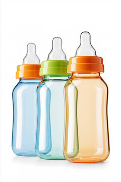 Three colorful plastic baby feeding bottles lined up in a row against a plain white background.