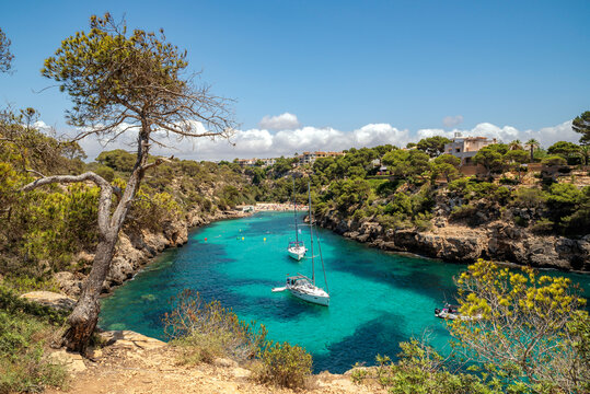 Aerial view of two yachts anchored in turquoise waters, Cala Pi, Llucmajor, Majorca, Balearic Islands, Spain