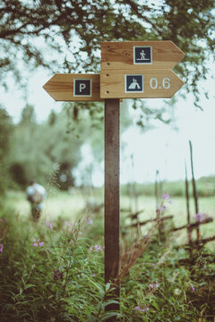 Wooden trekking trail sign in the rural countryside, Sweden