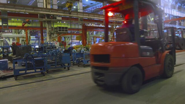 Red Forklift Operating in Industrial Warehouse Facility