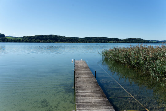 Wooden pier extending into Waginger See lake