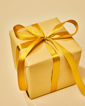 Elegant Golden Gift Box with Ribbon