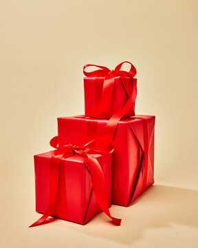 Stacked Red Gift Boxes With Ribbons