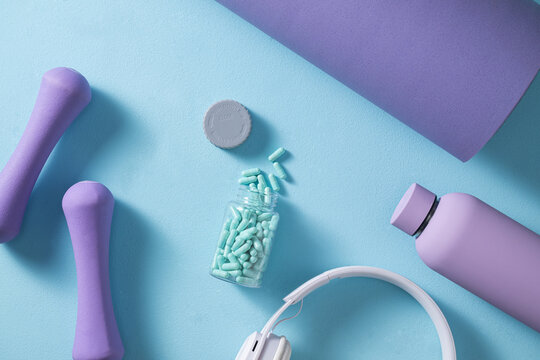 Fitness and wellness essentials and dumbbells, health supplements