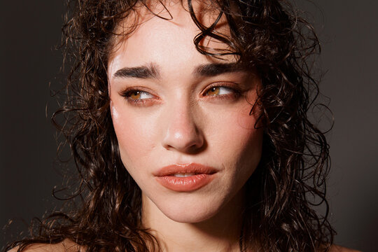 Portrait of a Woman With Curly Hair in a Studio Setup